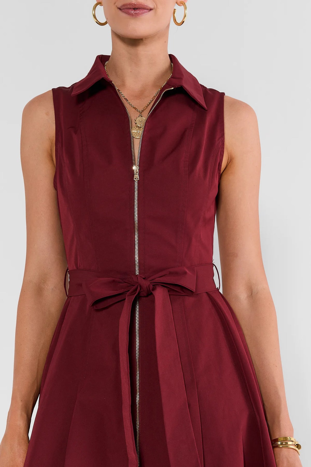 Burgundy Zip Up Midi Dress - Gold Zipper and Bow Belt Close-Up Detail | Avara