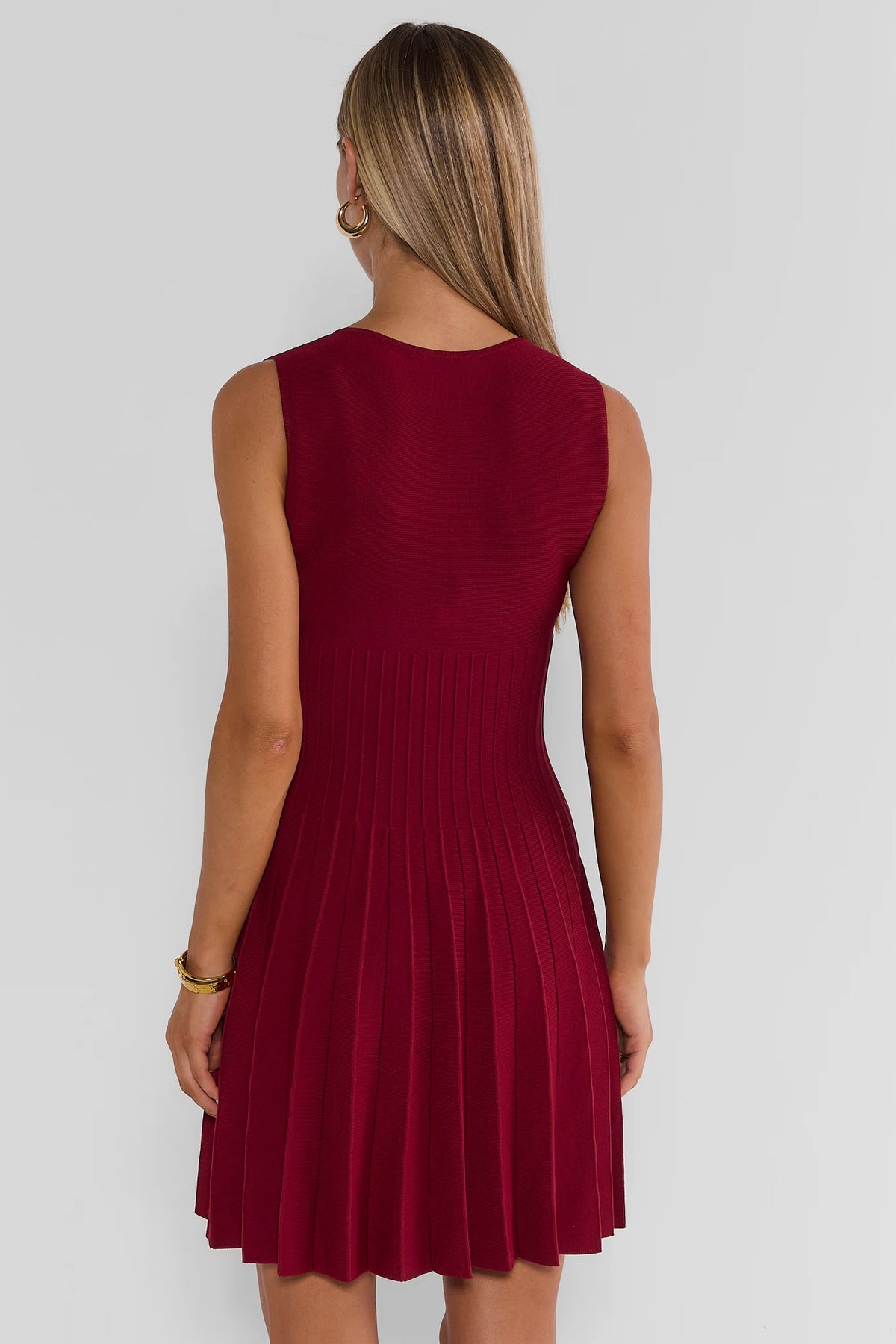 Burgundy Pleated Short Dress - Back View On Model | Avara