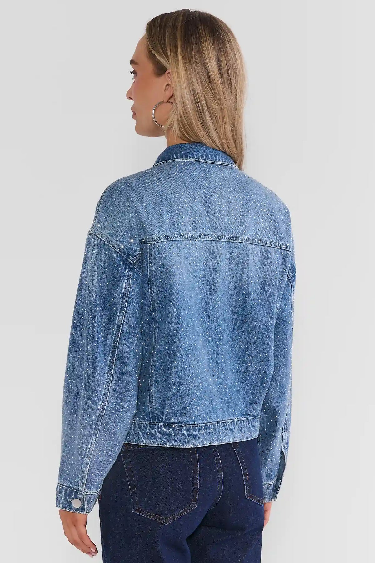 Medium Wash Rhinestone Denim Jacket - Back View On Model Showing Allover Rhinestone Detail | Avara