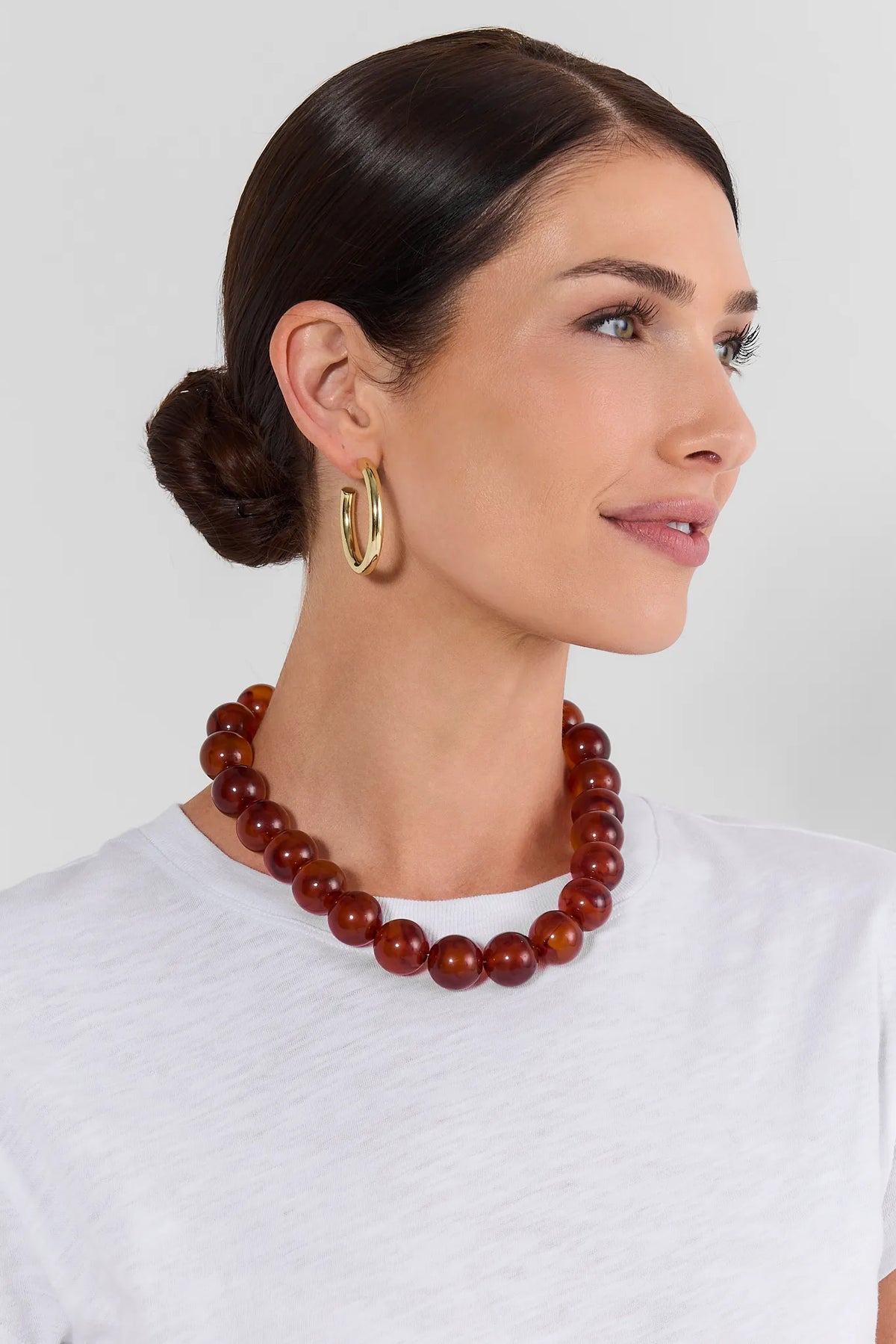Brown Tortoise Chunky Beaded Necklace - On Model Side Profile with White Top | Avara