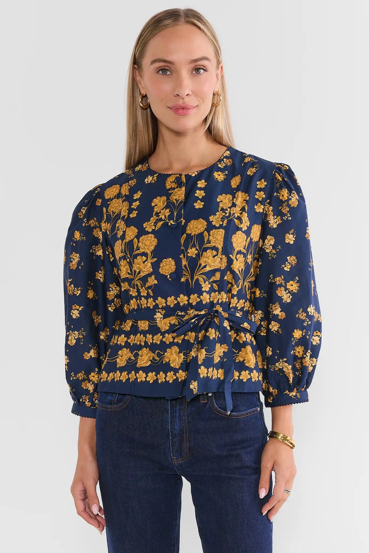 Navy Floral Printed Peplum Top - Front View On Model with Denim | Avara