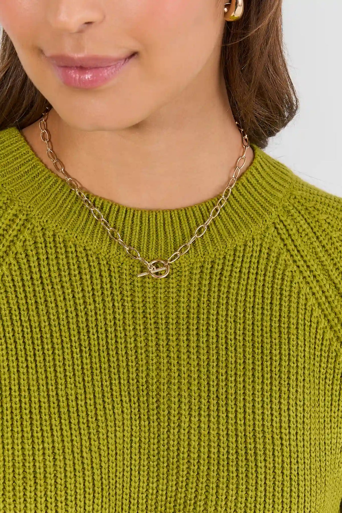 Gold Chain Toggle Necklace On Model Over Olive Knit Sweater - Front View | Avara