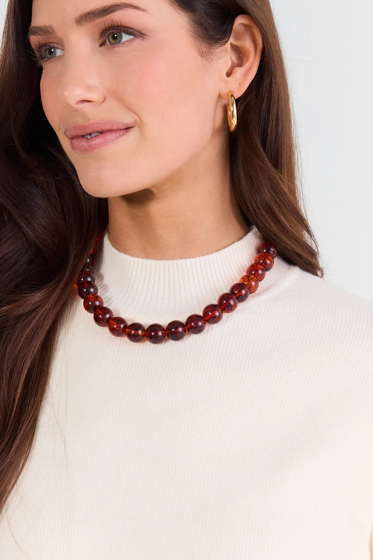 Amber Brown Beaded Necklace On Model with Cream Turtleneck - Front View | Avara