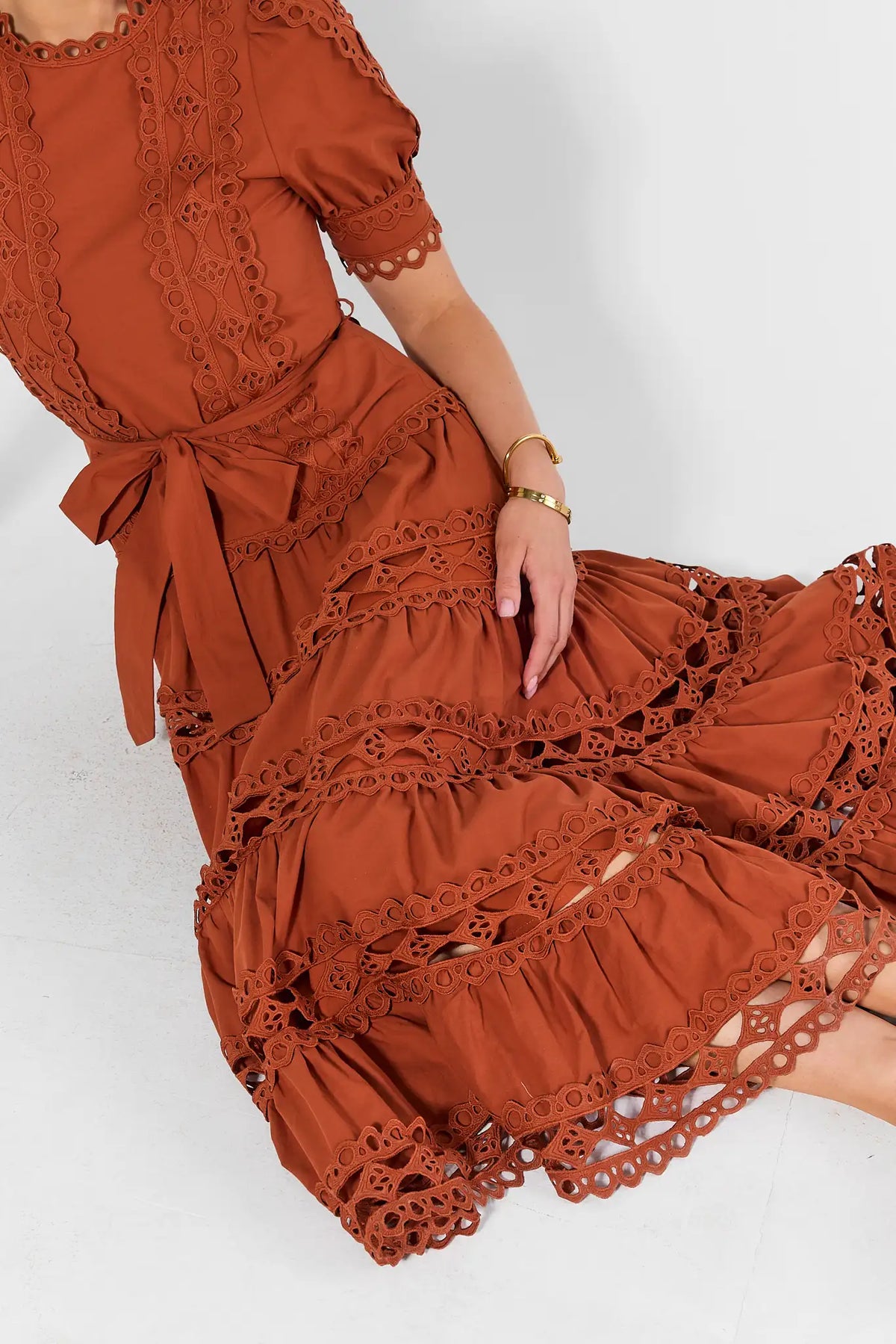 Rust Eyelet Dress - Close-Up Tiered Skirt & Cutwork Detail | Avara