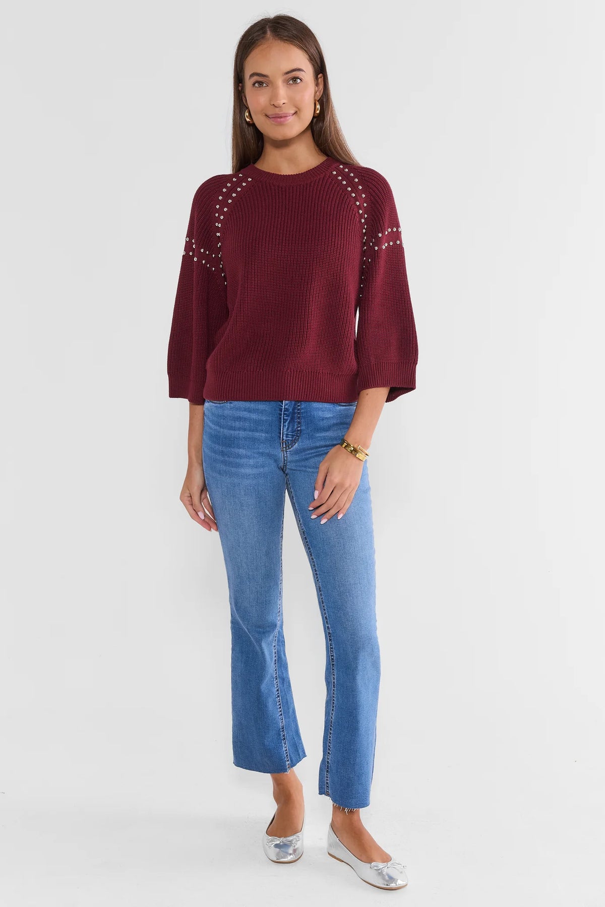 Burgundy Studded Sweater Styled with Flare Jeans - Full Length Front | Avara