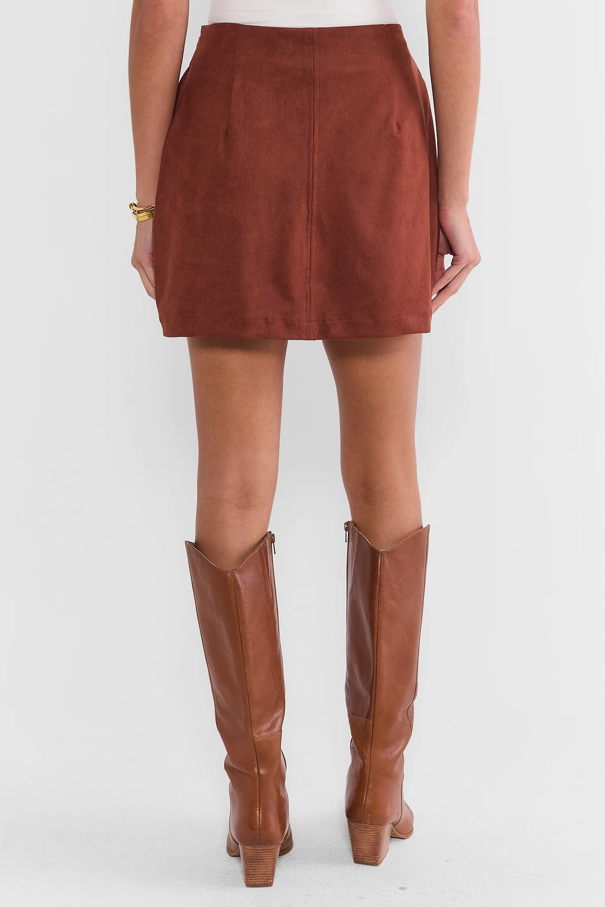 Brown Faux Suede Mini Skirt - Back View, Smooth Finish On Model | Avara