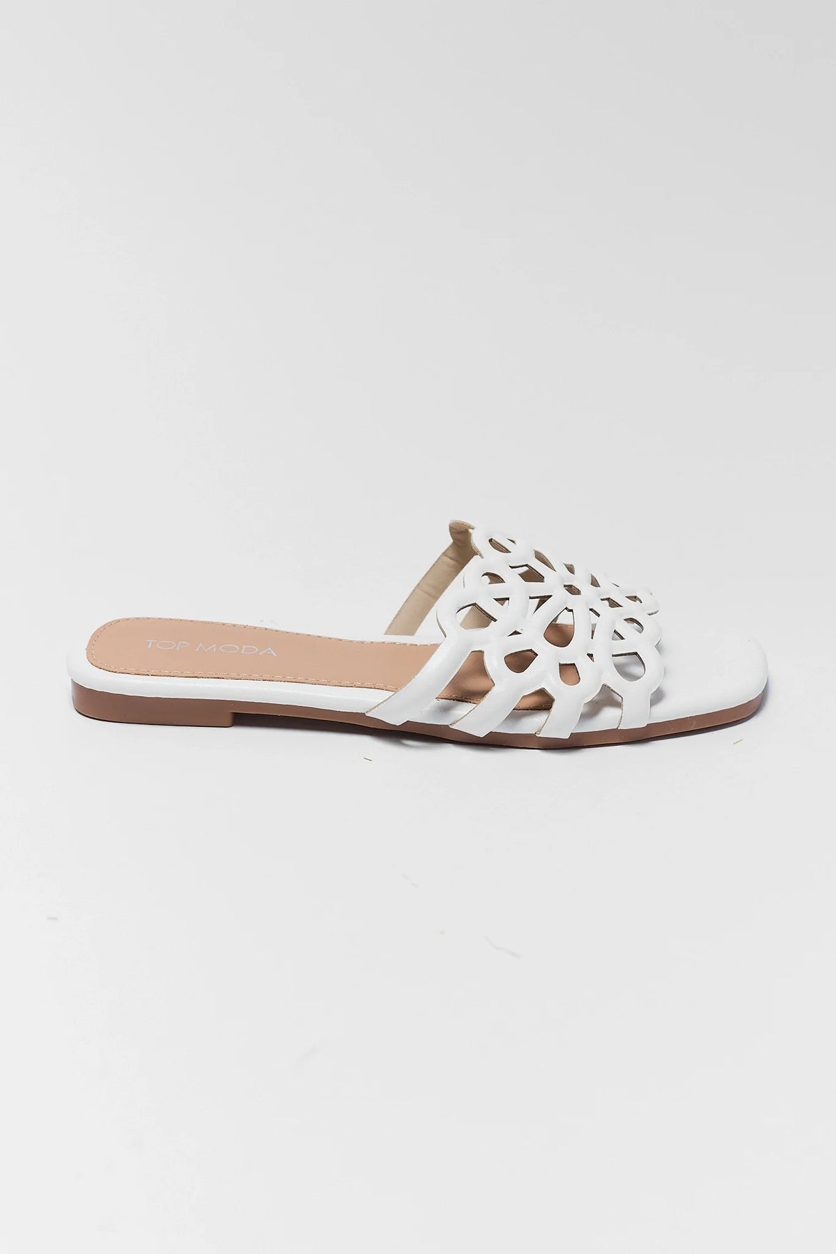 White cutout floral slide sandal with square toe - side profile view | Avara