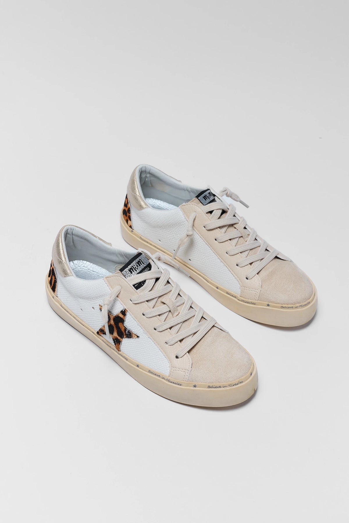 White Leopard Print Star Sneakers - Pair Flat Lay, beige suede toe and leopard heel accent | Avara