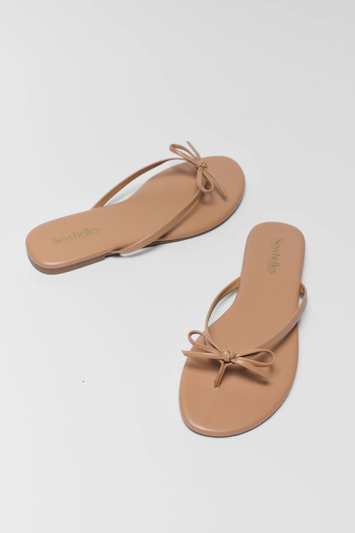 Seychelles Wish List Tan Sandals with bow detail - Angled Pair View | Avara