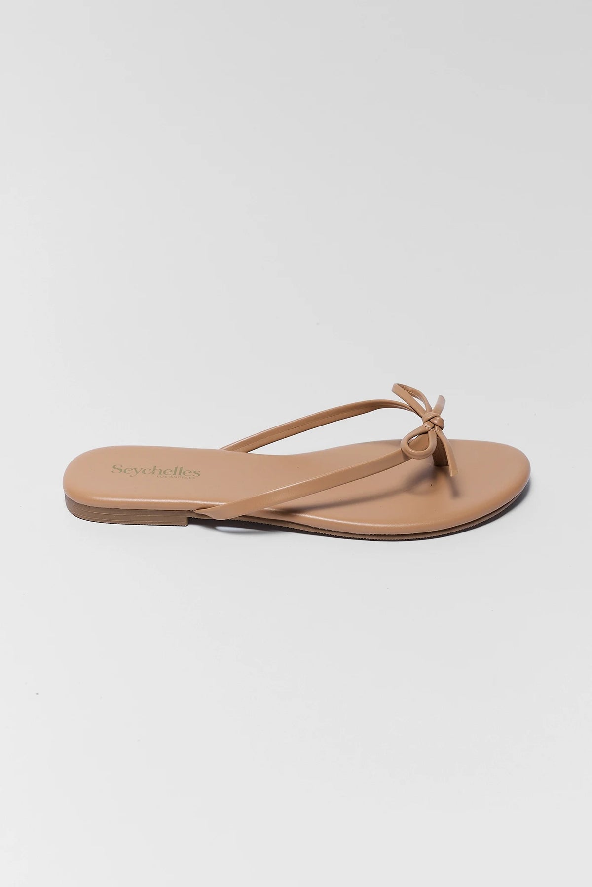 Seychelles Wish List Tan Sandal with bow detail - Side Profile View | Avara
