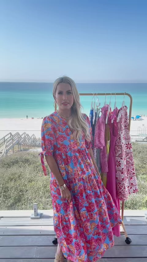 woman wearing harriet dress with beach in background