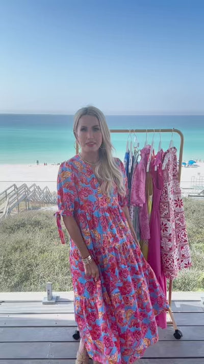 woman wearing harriet dress with beach in background