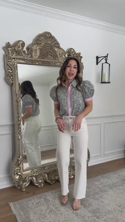 Woman wearing Tara straight leg ankle jeans with mirror in background