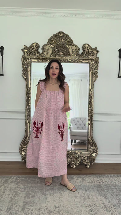 woman wearing lobster embroidered dress