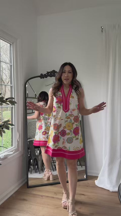 woman wearing justine dress with mirror in background