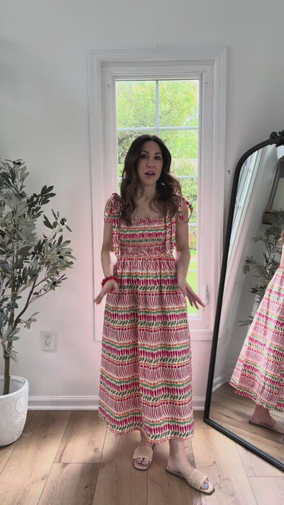 woman wearing multi print smocked maxi dress