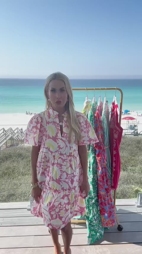 woman wearing evan dress with beach in background