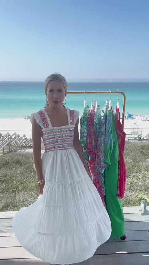woman wearing white tristan dress with beach in background