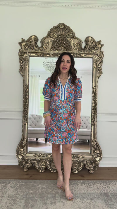 woman wearing blue multi printed dress short