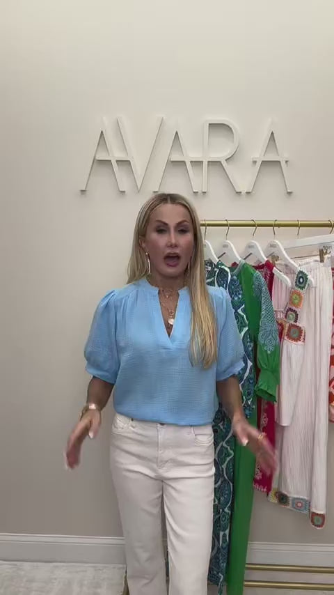 woman wearing tammy light blue top