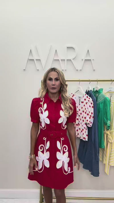 woman wearing red margot dress with rack in background