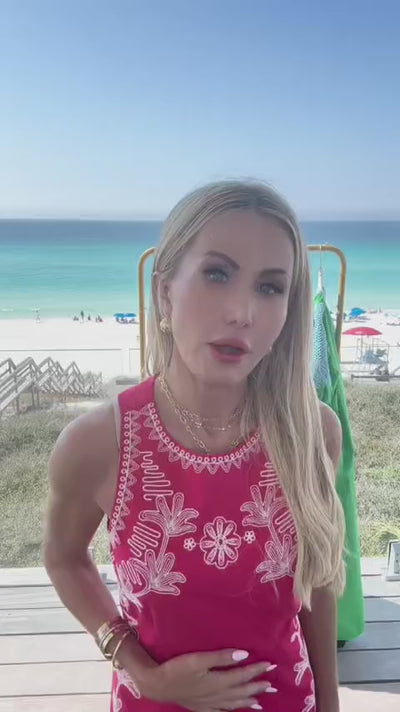 woman wearing kelby dress with beach in background