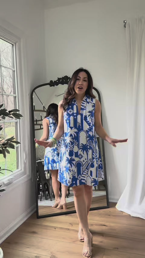 woman wearing blue ellen dress with mirror in background