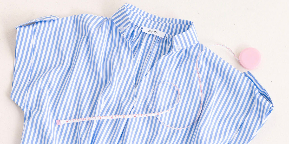 Blue and white striped shirt with a visible brand label on a light background